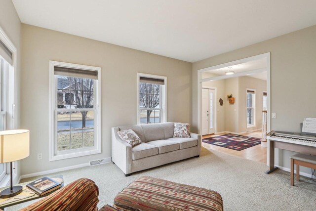 living room with light colored carpet