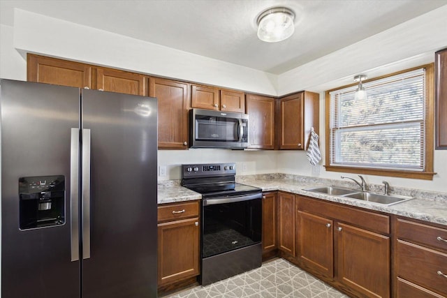 kitchen featuring stainless steel appliances and sink