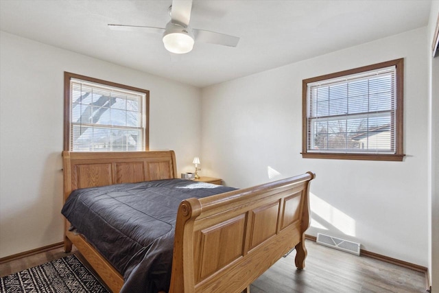 bedroom featuring hardwood / wood-style flooring and ceiling fan