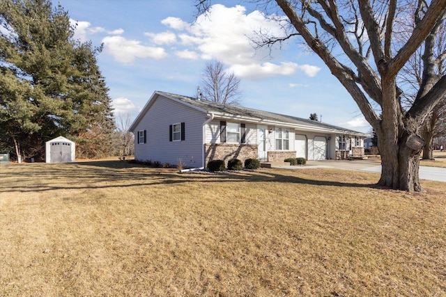 view of front facade featuring a garage, a storage unit, and a front lawn