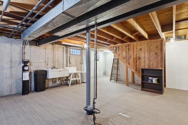 basement with carpet and sink