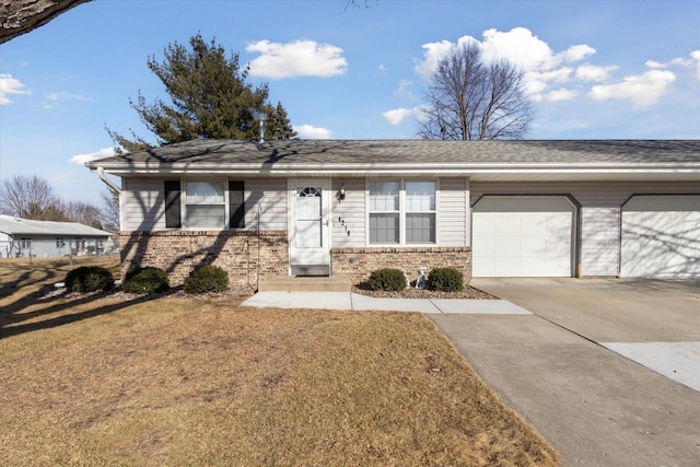 single story home featuring a garage and a front lawn