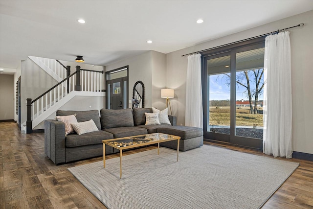 living room with dark hardwood / wood-style flooring