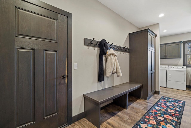 mudroom featuring separate washer and dryer and light hardwood / wood-style floors