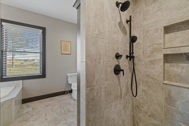 bathroom featuring tiled shower and toilet