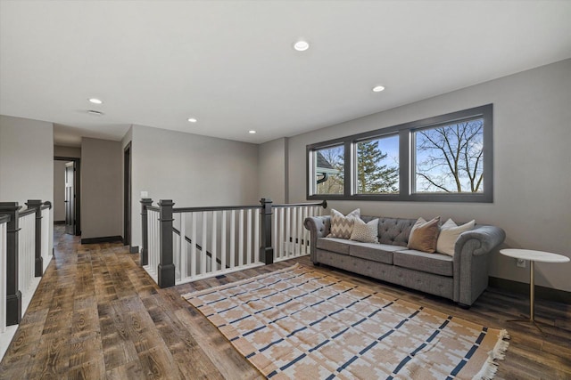 sitting room with hardwood / wood-style flooring