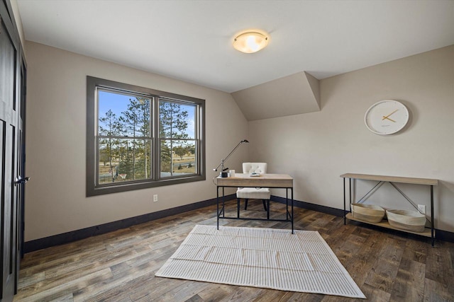 home office featuring vaulted ceiling and dark hardwood / wood-style floors