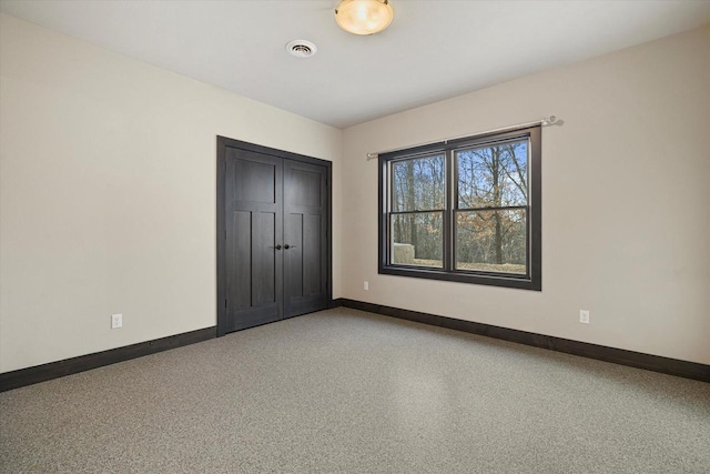 unfurnished bedroom featuring a closet