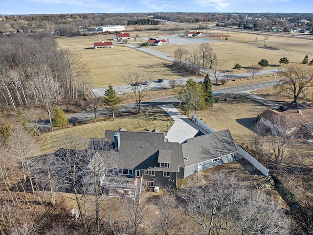 birds eye view of property with a rural view