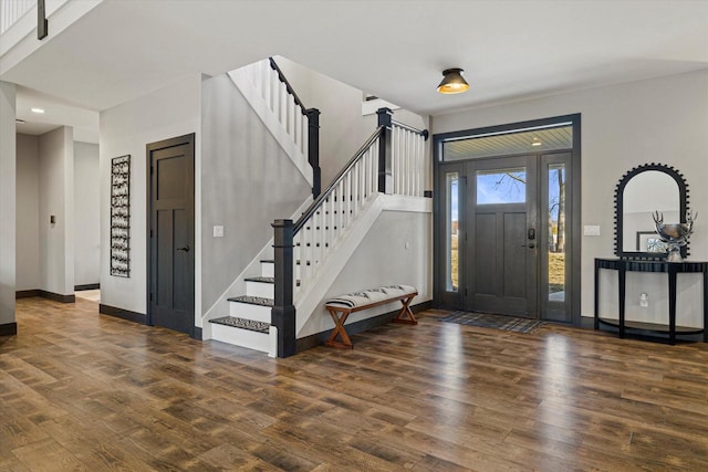 foyer entrance featuring dark hardwood / wood-style floors