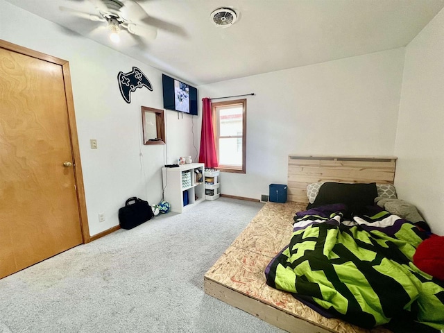 bedroom with ceiling fan and carpet