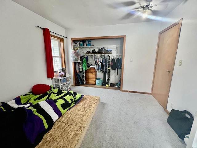 bedroom with carpet floors, ceiling fan, and a closet