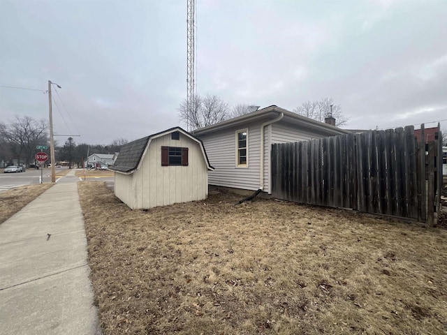 view of home's exterior featuring a storage unit