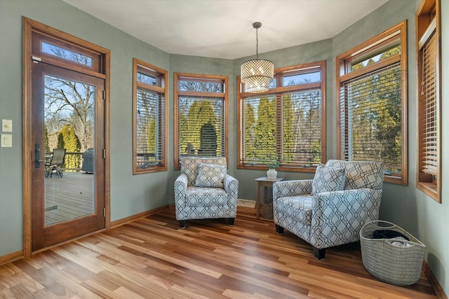 living area with a healthy amount of sunlight and wood-type flooring