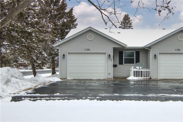 ranch-style house featuring a garage