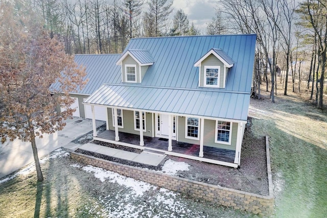 view of front of home with a porch and a front yard