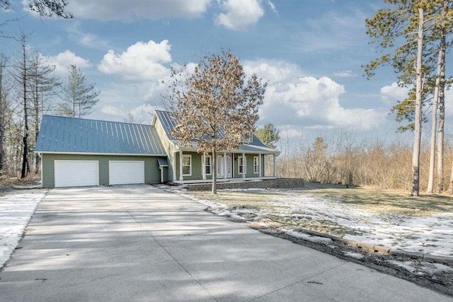 view of front facade featuring a garage and covered porch