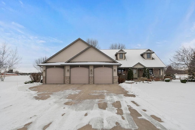 view of front of property with a garage and covered porch