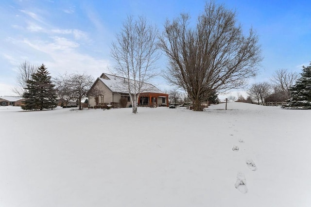 view of yard layered in snow