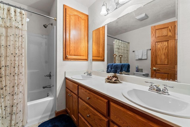 bathroom with vanity and shower / tub combo