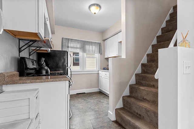 kitchen featuring white cabinets