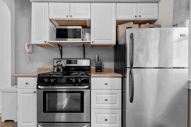 kitchen with white cabinetry and stainless steel appliances