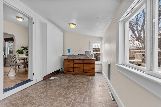 hall with lofted ceiling