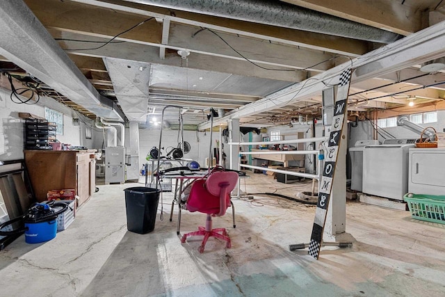 basement with separate washer and dryer and heating unit