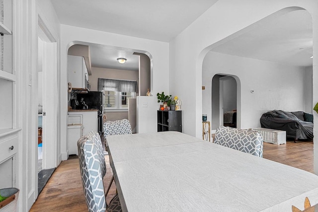 dining space featuring hardwood / wood-style floors