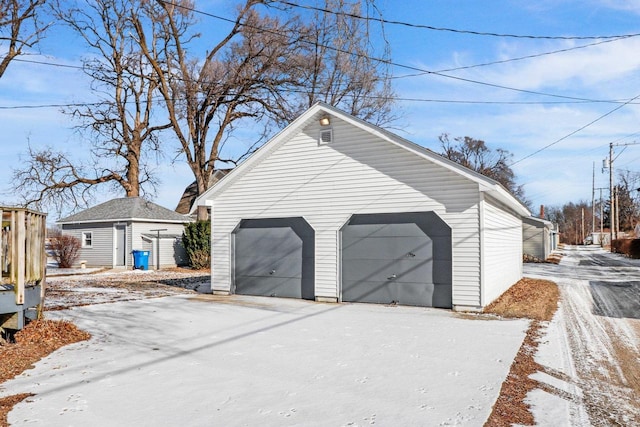 view of snow covered garage