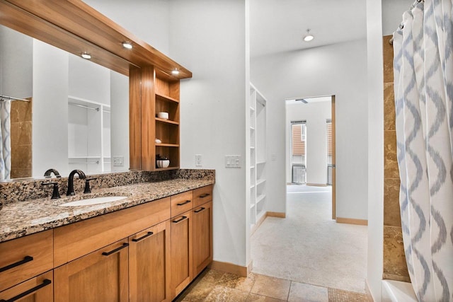 bathroom with vanity, tile patterned floors, and walk in shower