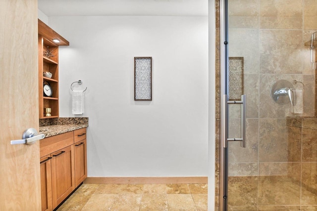 bathroom with walk in shower and vanity