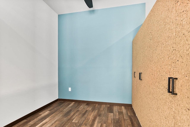 empty room featuring ceiling fan and dark hardwood / wood-style floors