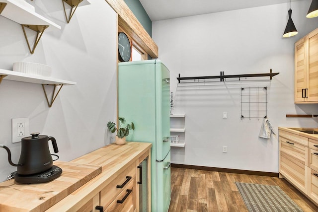 laundry room featuring dark hardwood / wood-style floors and sink