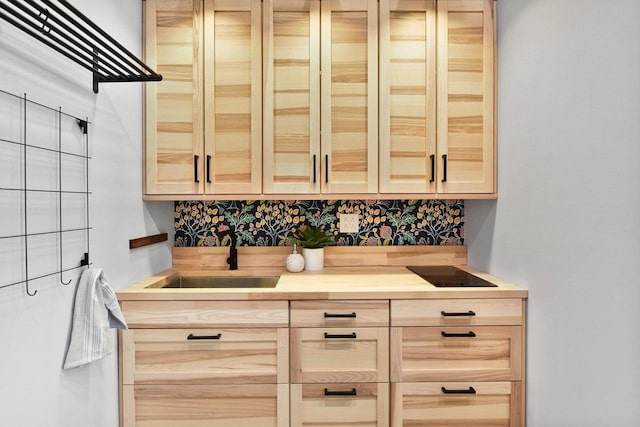 bar featuring sink and light brown cabinets