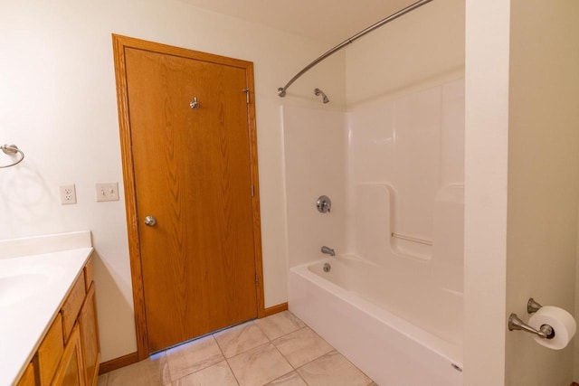 bathroom with shower / bath combination, vanity, and tile patterned flooring