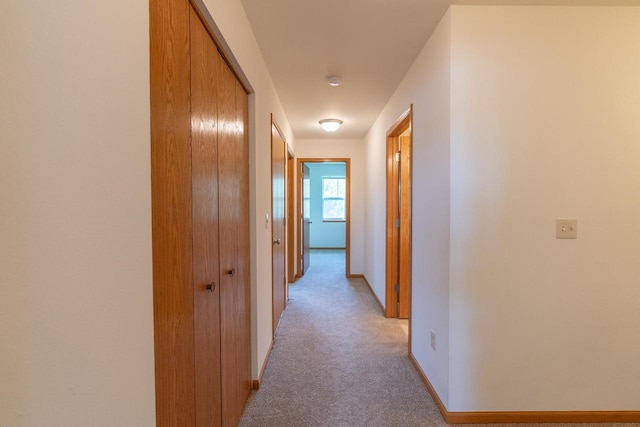 corridor with light carpet