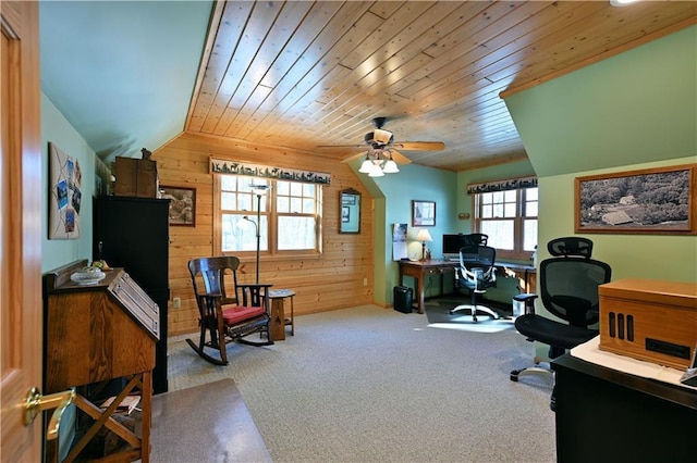 office space featuring lofted ceiling, wood ceiling, wooden walls, and light carpet