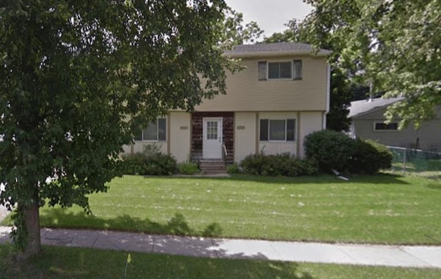 view of front of house with a front lawn