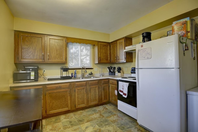 kitchen with sink, electric range, and white refrigerator