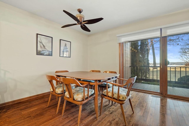 dining area with hardwood / wood-style flooring and ceiling fan