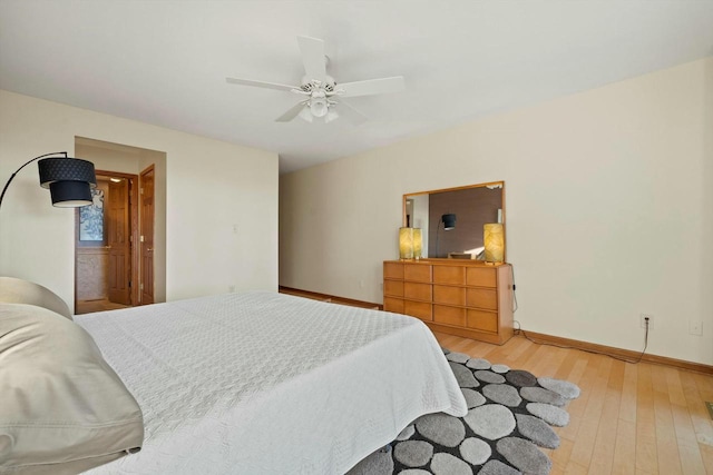 bedroom featuring hardwood / wood-style flooring and ceiling fan