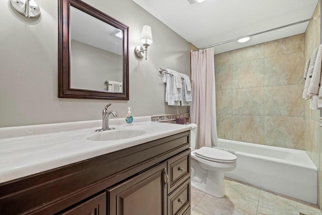 full bathroom featuring vanity, shower / bathtub combination with curtain, tile patterned floors, and toilet