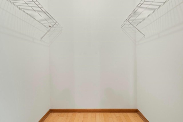 walk in closet featuring hardwood / wood-style floors