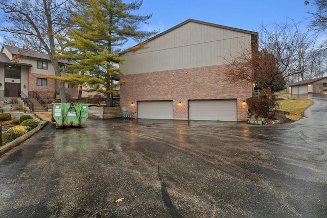 view of side of home featuring a garage