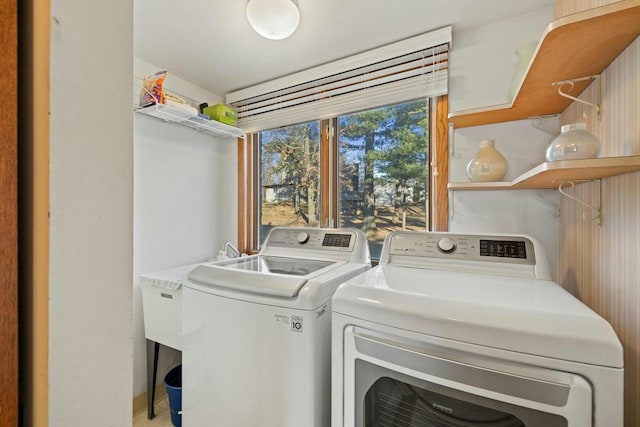 laundry room with separate washer and dryer