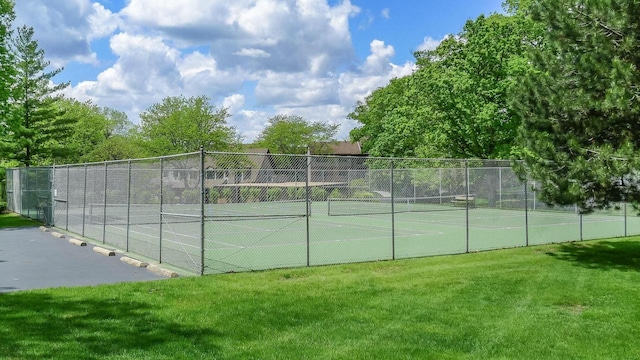 view of sport court featuring a yard