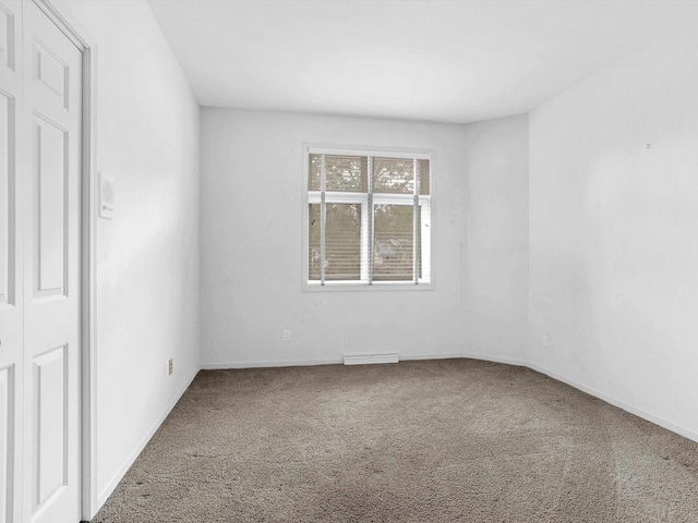 unfurnished room featuring carpet flooring