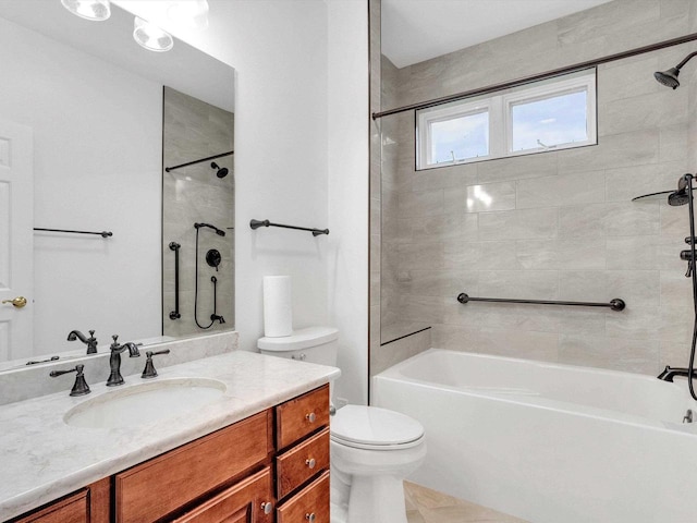 full bathroom featuring vanity, tiled shower / bath combo, and toilet