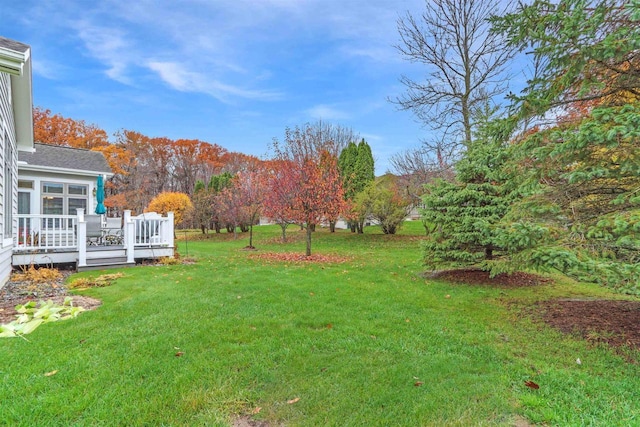 view of yard featuring a wooden deck